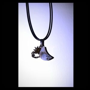 Moon pendant with sun and cloud on black cord 18in